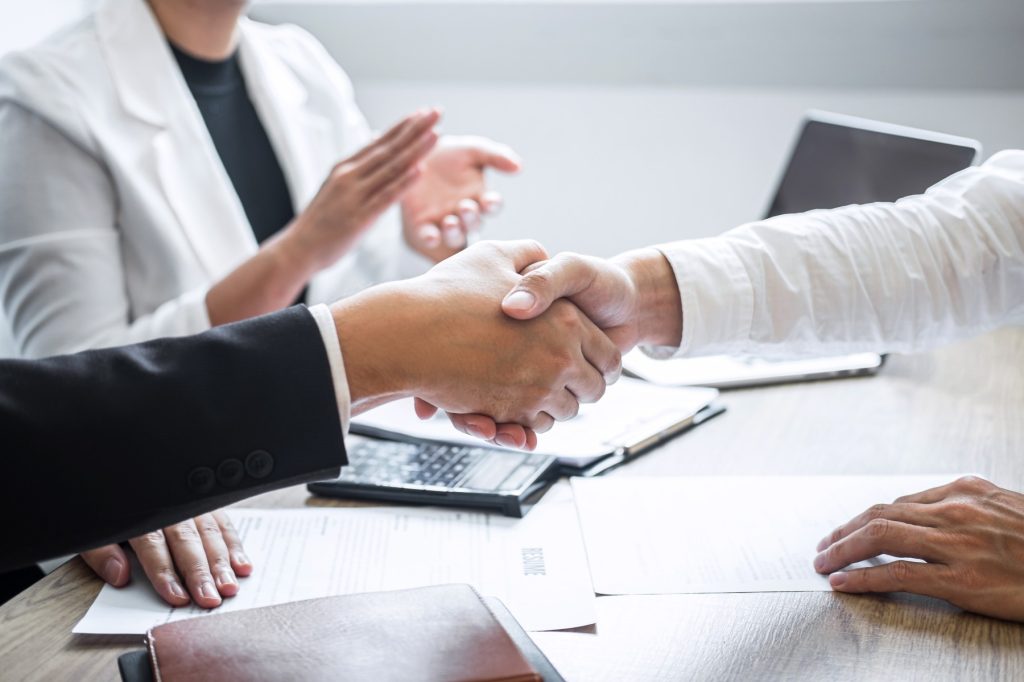 Successful job interview, Image of Boss employer committee or recruiter in suit and new employee shaking hands and clap after good deal negotiation interviewing, career and placement .